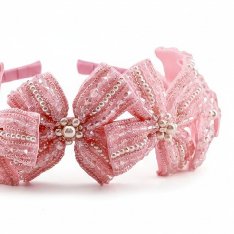 Close up of the hand beaded details on the childrens handmade pink crystal bow headband by Sienna Likes to Party