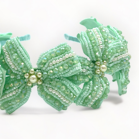 Best Designer hair accessories by Sienna Likes to Party, luxury hair accessories for children.  This bow headband is entirely handmade with mint crystal and pearl beads.  Perfect partywear headpiece for children.