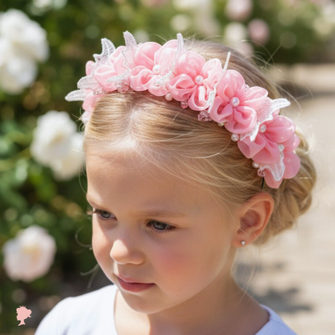 Flower girl wearing a pink floral headband at a wedding.  Designer handmade flower crown.