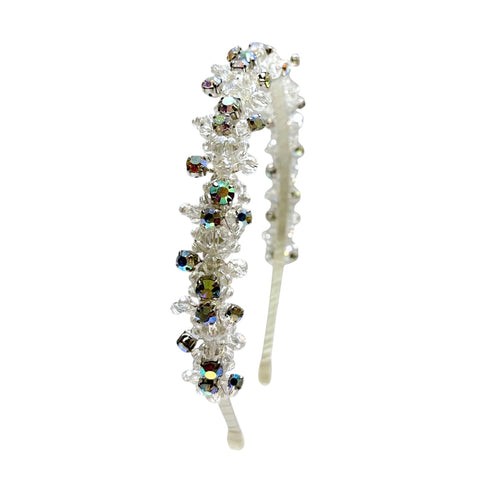 The Andrea Headband is an entirely handmade girls crystal headband in white that is uniquely hand embelished with with  best quality rainbow rhinestones for dazzling sparkle and unique luxury.  Perfect for flower girls and special occasionwear for children