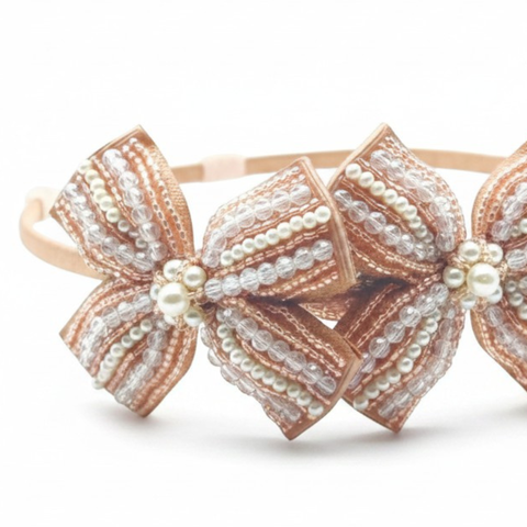 Luxury handmade girls bow headband in blush pearls and crystals on 3 petersham fabric bows.