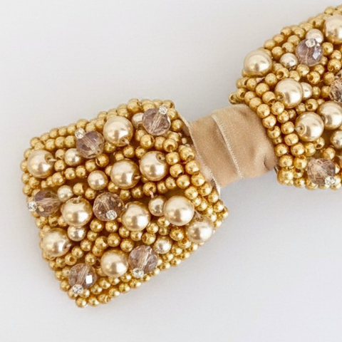 Close up of Designer Girls Gold Pearl and Crystal hand beaded bow hair clip
