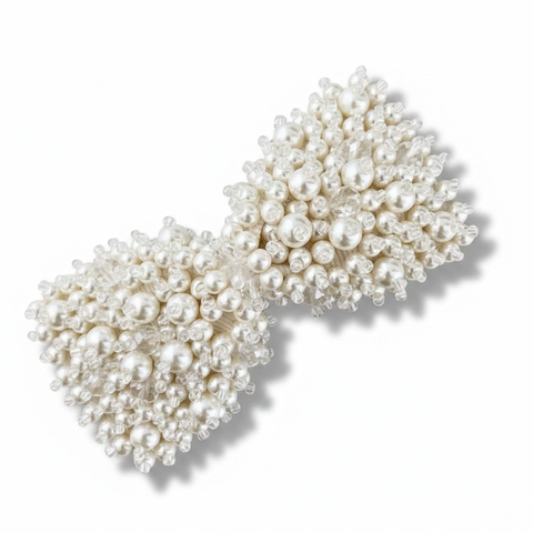 Luxury ivory hand beaded pearl and crystal bow hair clip for children by Sienna Likes to Party - the designer handmade childrens hair accessories specialist.