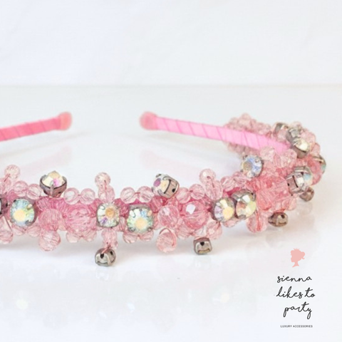 Designer Childrens pink crystal headband, hand embelished with pastel pink faceted crystals and highlighted with large rainbow rhinestones for extra sparkle