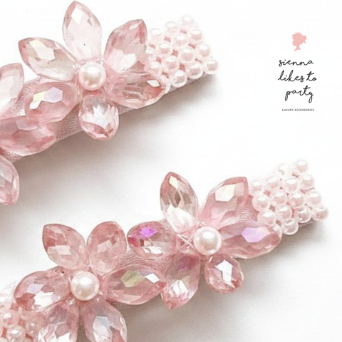 Hand beaded pink floral hair clips with faceted crystal flowers and pearl centers, uniquely handmade by Sienna Likes to Party - the leaders in bespoke hair accessories for children