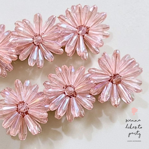 Closeup of individually handmade pink crystal hair accessories for children