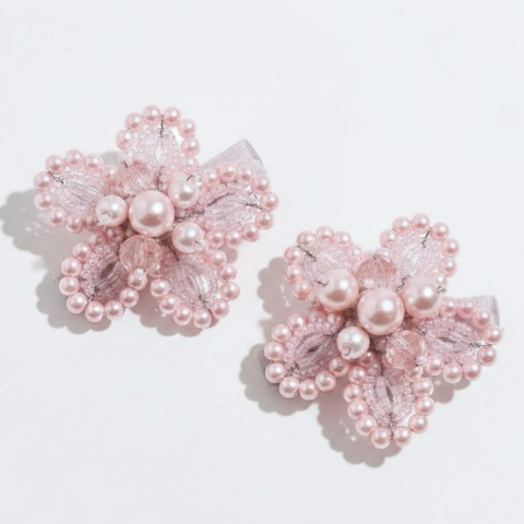 Girls handmade pastel pink hair clip set.  Individually hand beaded with soft pink pearl and crystal beads.  A uniquely bespoke set perfect for flower girls, bridal or childrens special occasions by Sienna Likes to Party.