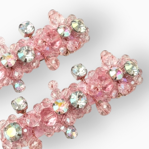 Close up of detail of Designer pink childrens hair clip set.  Entirely Handmade with pale pink faceted crystal beads and rainbow effect diamantes by Sienna Likes to Party - The specialists in luxury bespoke hair accessories for kids