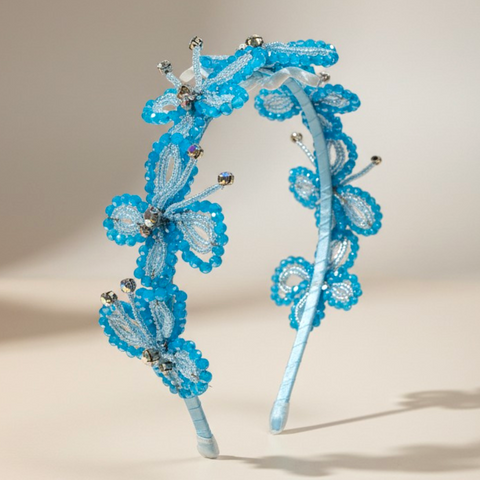Handmade luxury butterfly crystal headband for children in turquoise blue designed for weddings, parties and special occasions