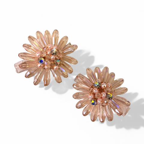 The Mia Hair Clip Set is handcreafted with different sized quality blush crystals and pearls and highlighted with hand stitched rainbox diamantes.  The Perfect childs hair Accessory for special occasionwear, kids birthday parties, weddings and flower girls
