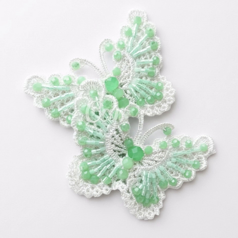 Luxury girls mint green butterfly hair clip.  Two layered best quality white lace butterflies are hand embelished with sparkling faceted pastel mint green crystals.  By Sienna Likes to Party - best designer hair accessories for children