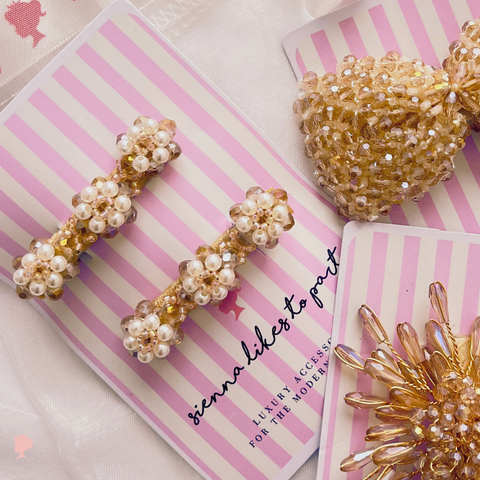The best girls designer hair clips.  These hair clips are handmade with luxury blush crystals and highly embelished with rainbow rhinestones for extra sparkle.  Perfect for weddings, bridal and kids birthday parties.