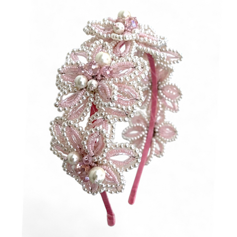 Handcrafted pink flower crown headband adorned with pearls and crystals, ideal for flower girls and special occasions.