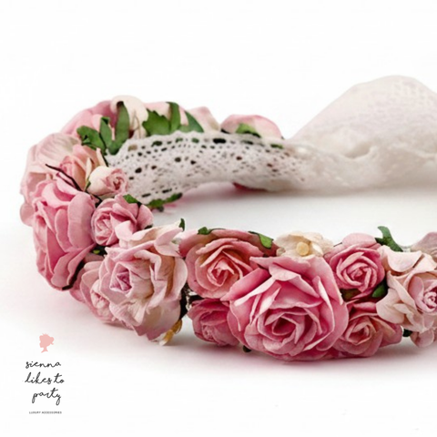 Close-up of hand-painted pink paper roses on the Rose Bud flower crown