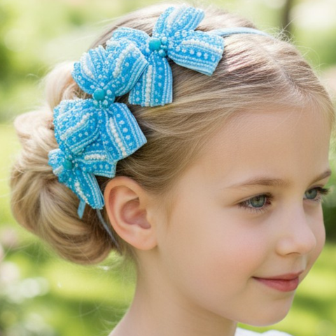 Bespoke girls handbeaded headband with two blue crystal bows.  Perfect for childrens special occasionwear.
