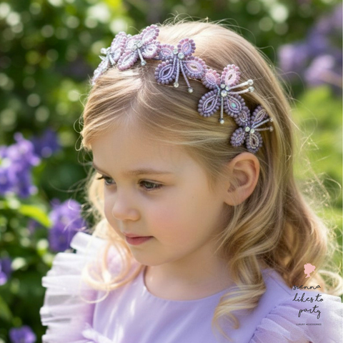 girl wearing butterfly headband at birthday party celebration