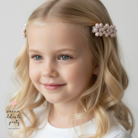 Handmade pink flower hair clips for girls with rainbow diamanté centres and couture-inspired pearl detailing