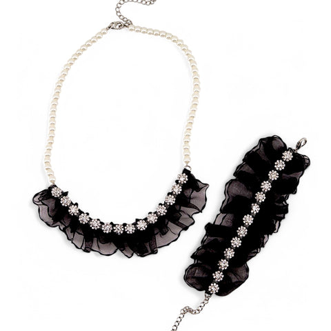 Custom-made designer jewelry for children.  This pearl and diamante necklace set on black chiffon is from a collection of luxury jewelry for girls by Sienna Likes to Party