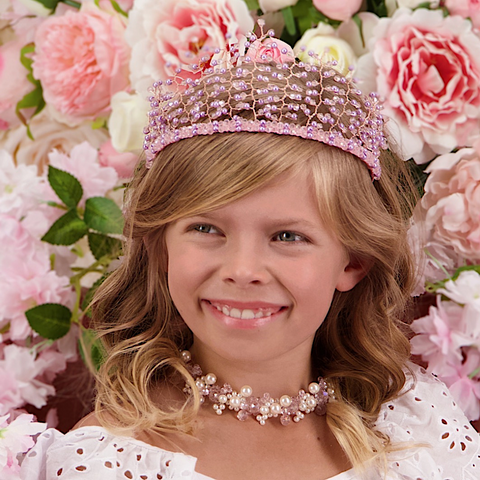 A young girl wearing the Love & Faith Princess Crown, ideal for flower girls and special occasions.