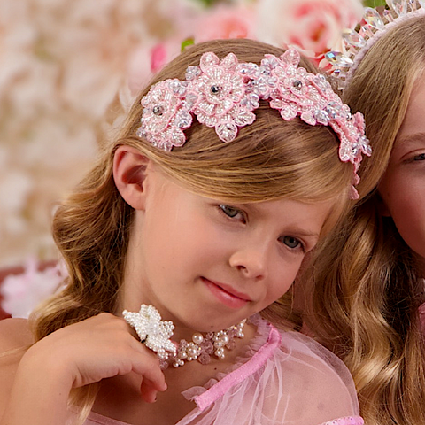 Young girl wearing the Hadraniel Silver Embellished Headband, ideal for kids birthday parties, special occasions and Easter gifting.