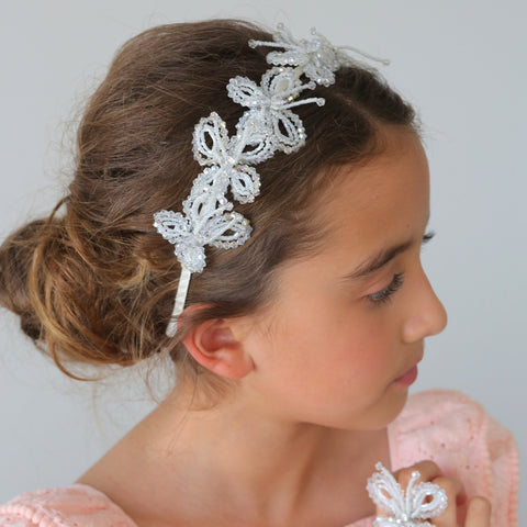 The Meadows and Dreams Crystal Headband is handmade with white and clear cut crystals to create butterflies around the entire satin covered headband.  Perfect bridal or special occasion hair accessory for children