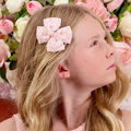Buy Designer Girls pink bow hair clip