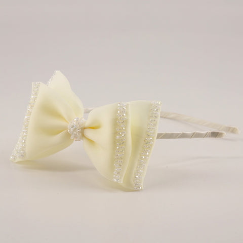 The Wonderland Designer Hair Bow Headband.
